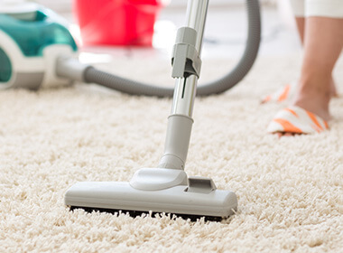Vacuum cleaning a carpet